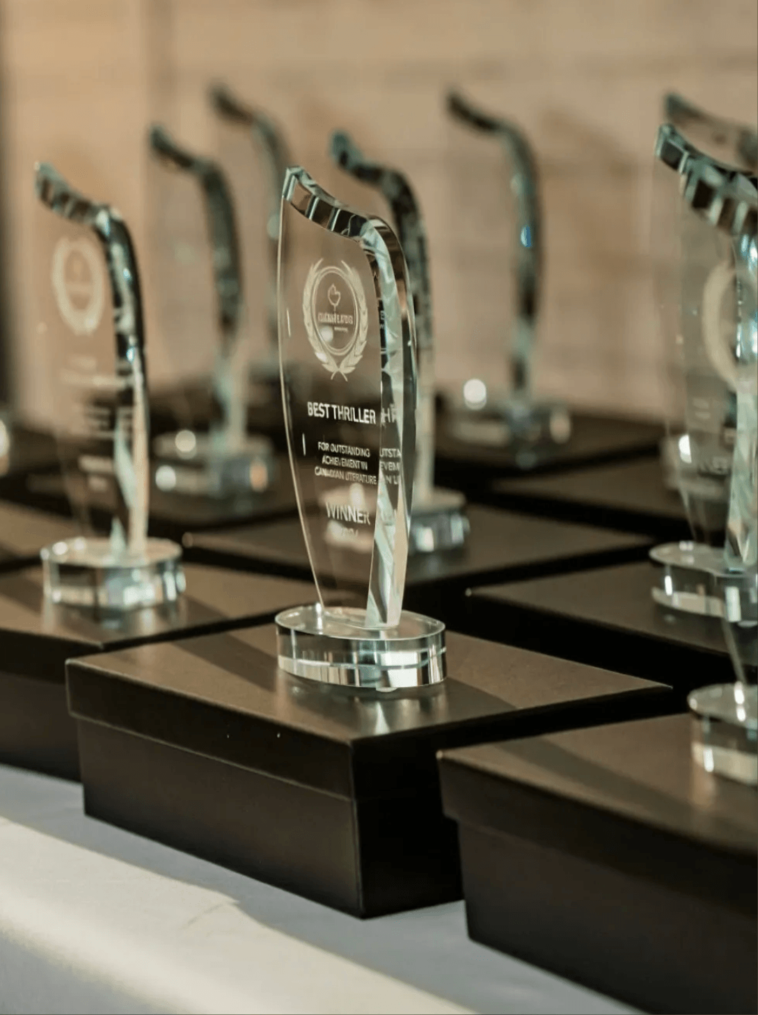 Glass CANREADS Book Awards trophies displayed at the 2026 awards event in Toronto